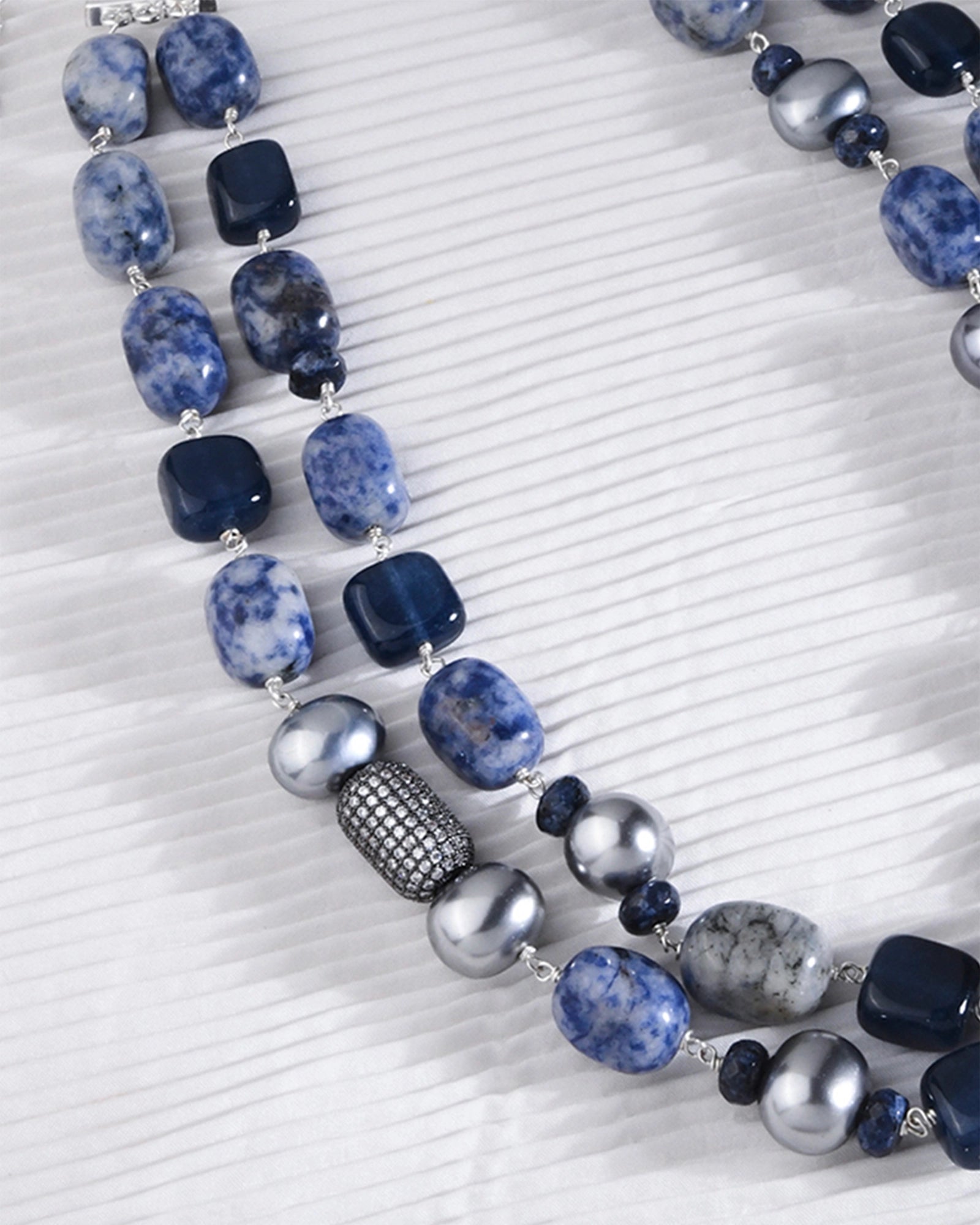 wo-layer necklace featuring silver beads and captivating blue jade stones