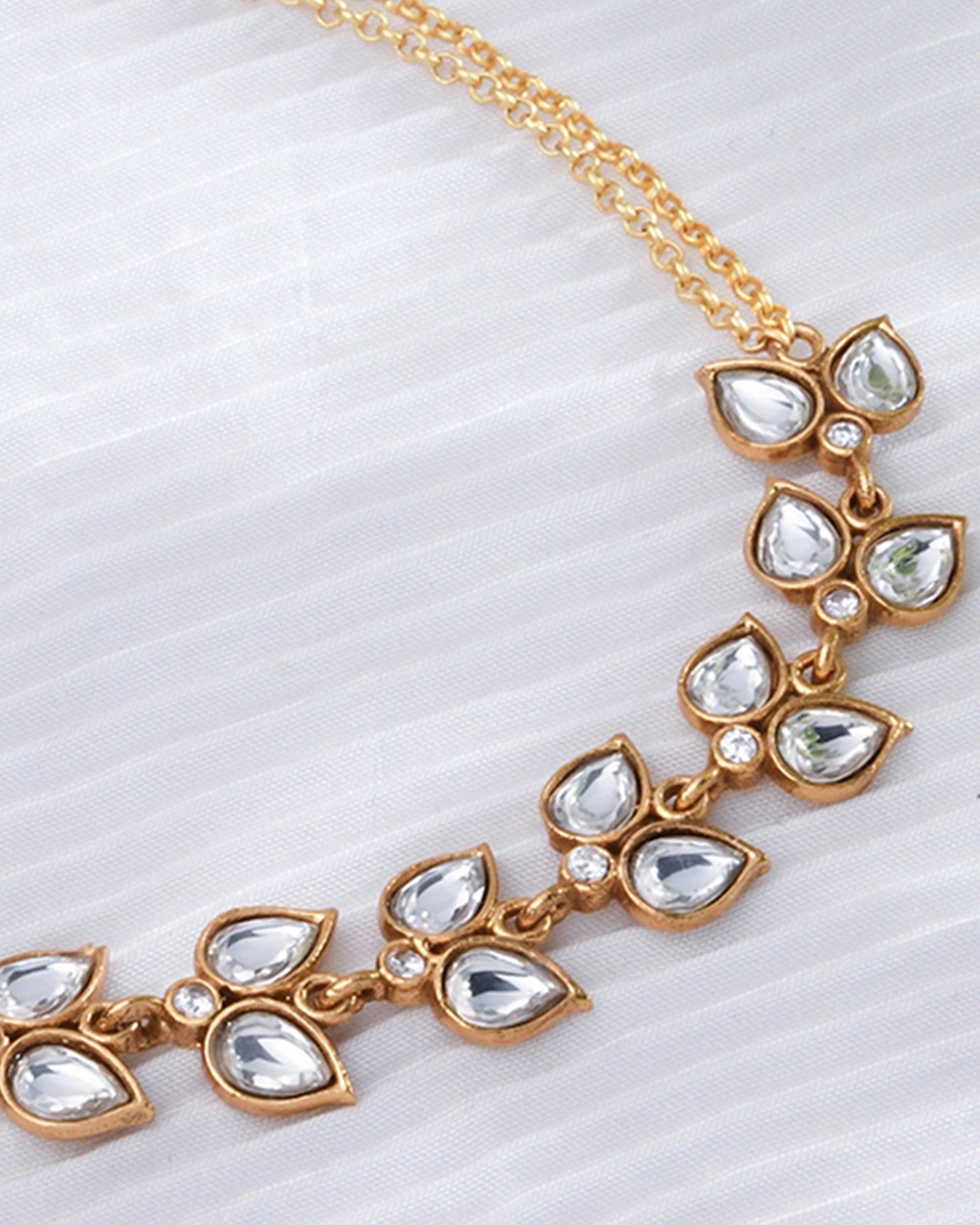 golden chain necklace featuring Polki stones