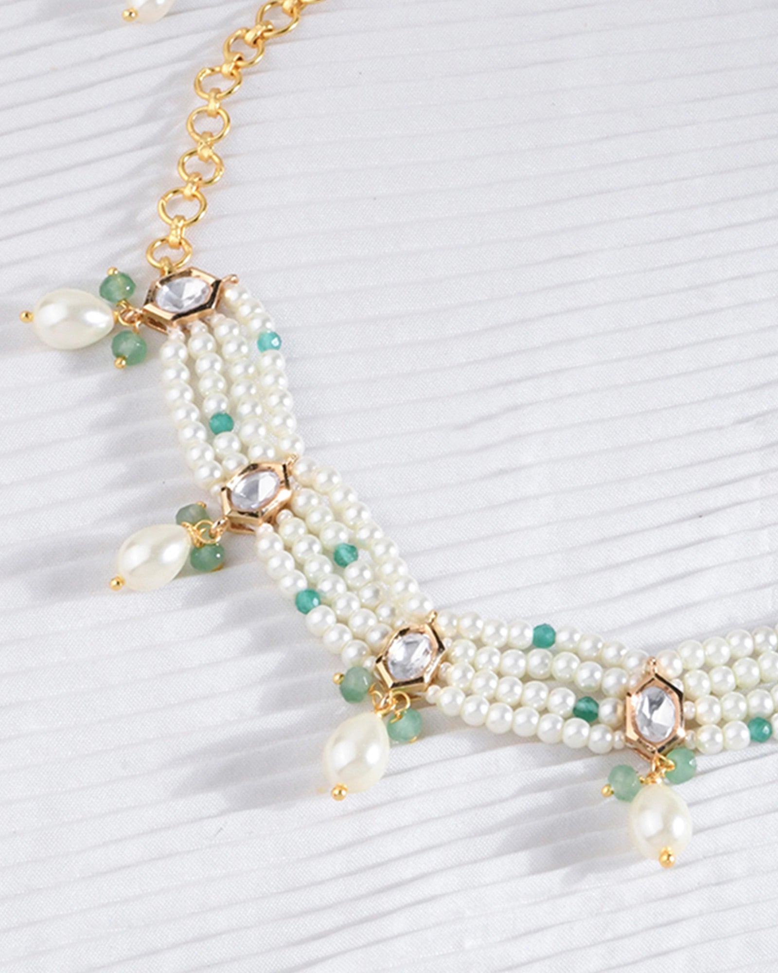 necklace featuring layered pearl strands with gracefully hanging pearls