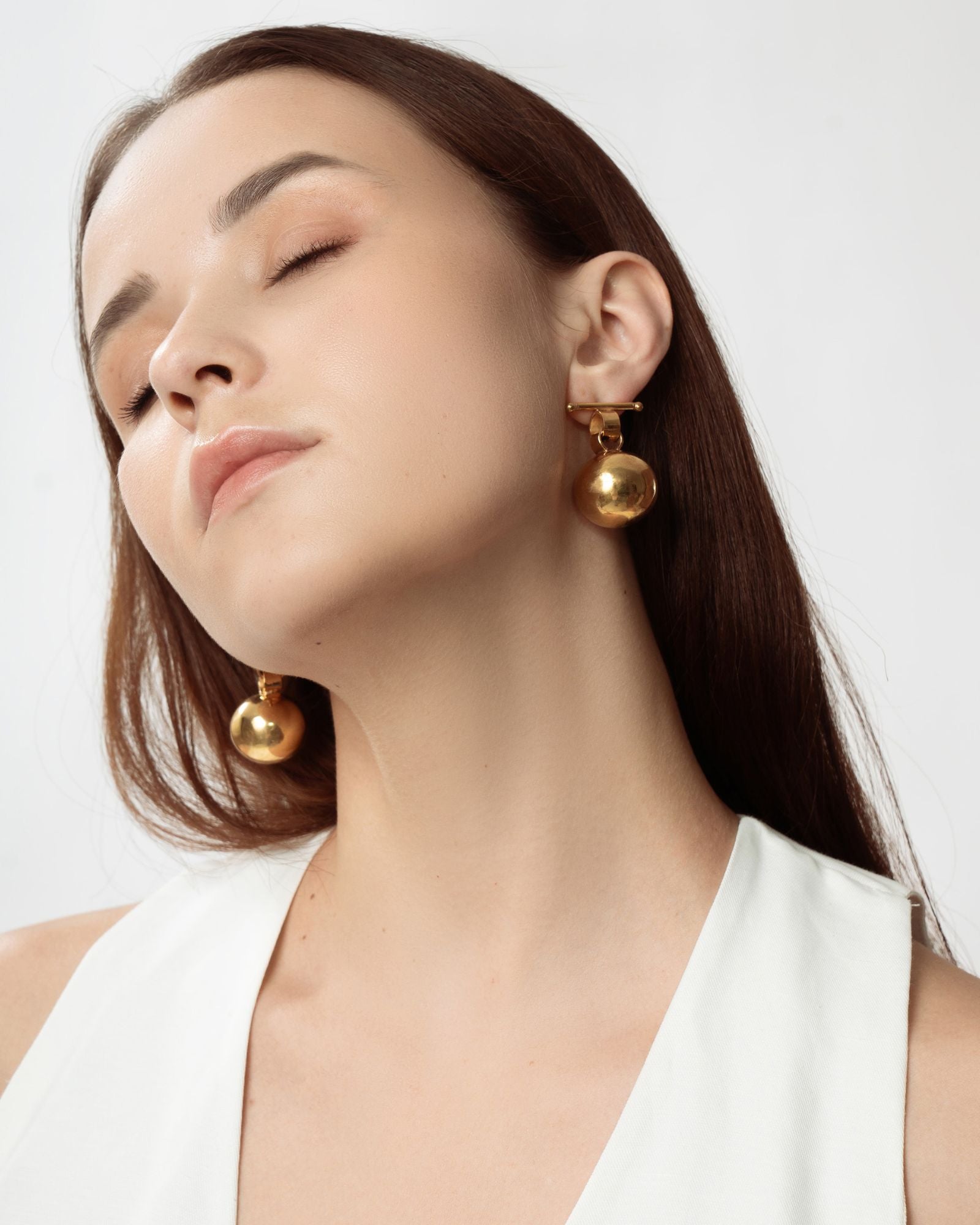 globe earrings - gold tone