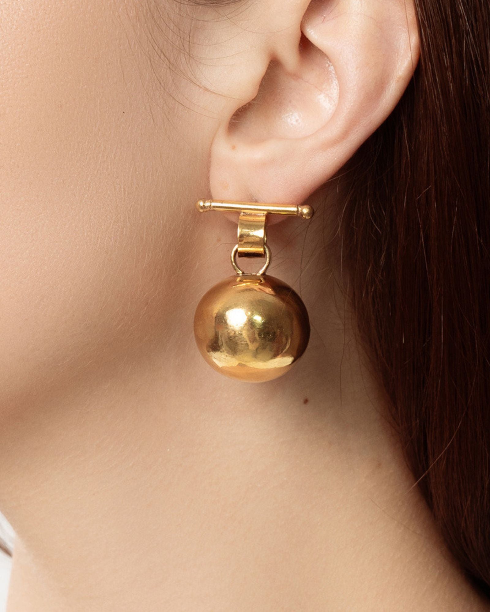 globe earrings - gold tone