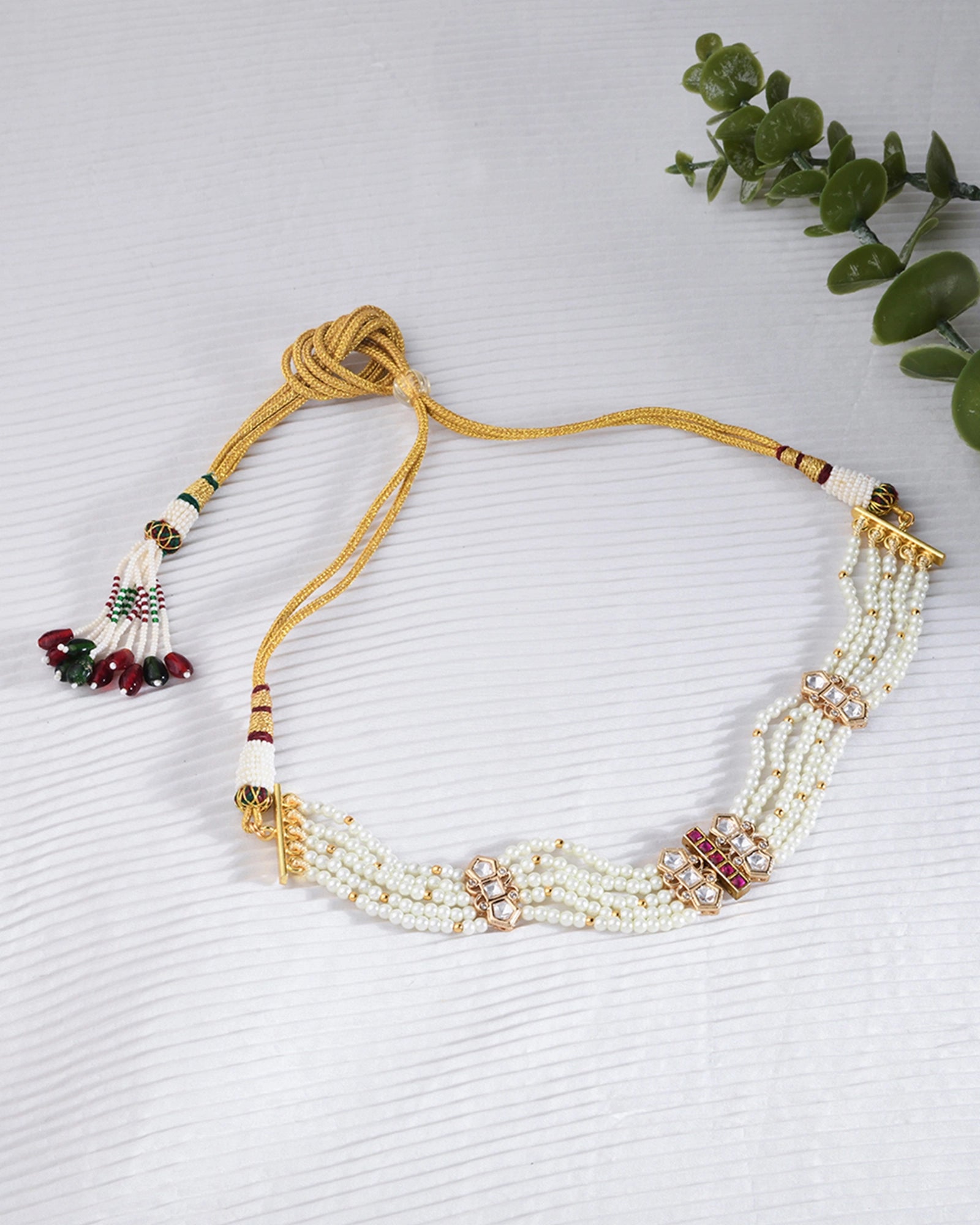 three-layer pearl necklace featuring delicate pink stones