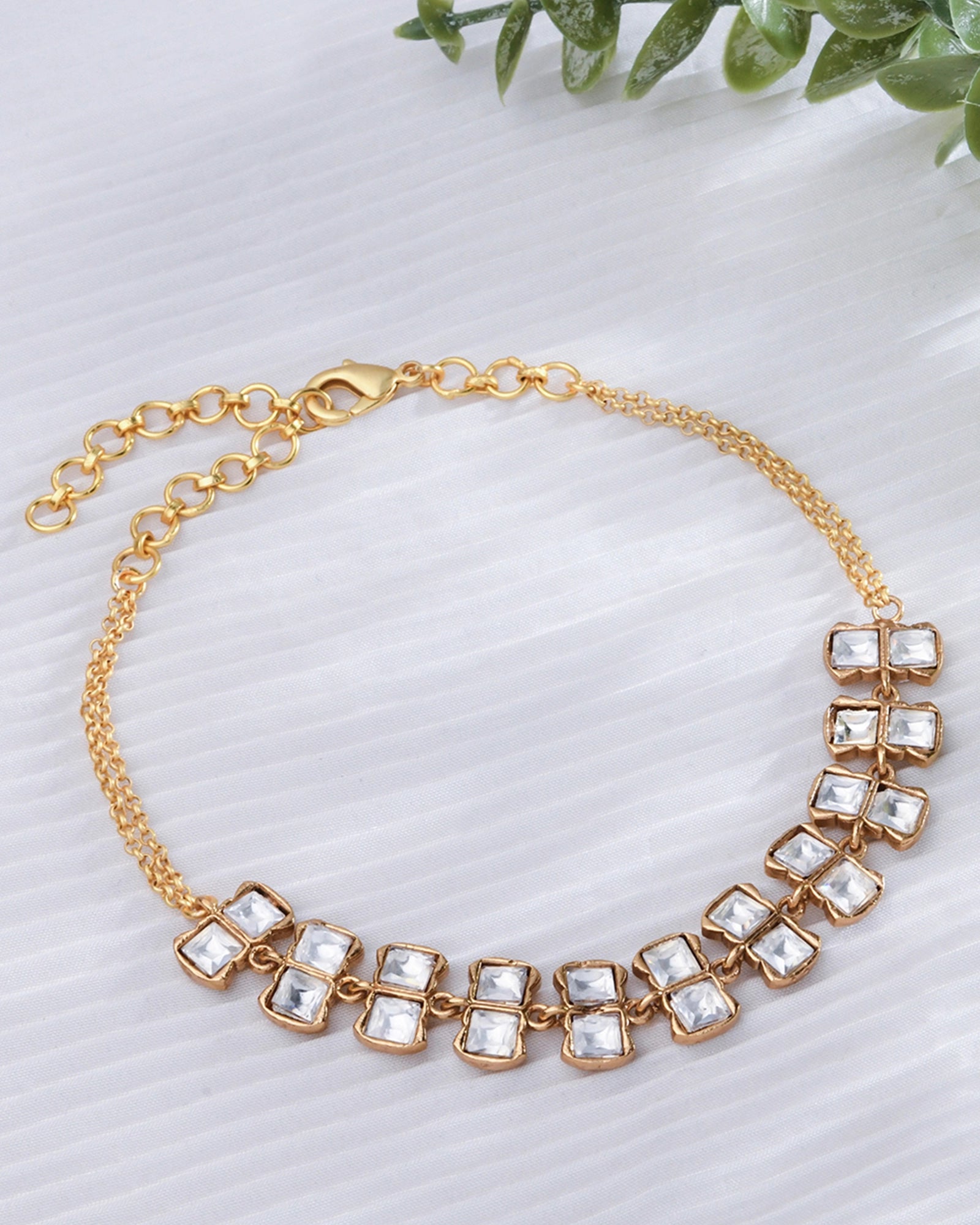 necklace showcasing square Polki motifs along a delicate loop chain