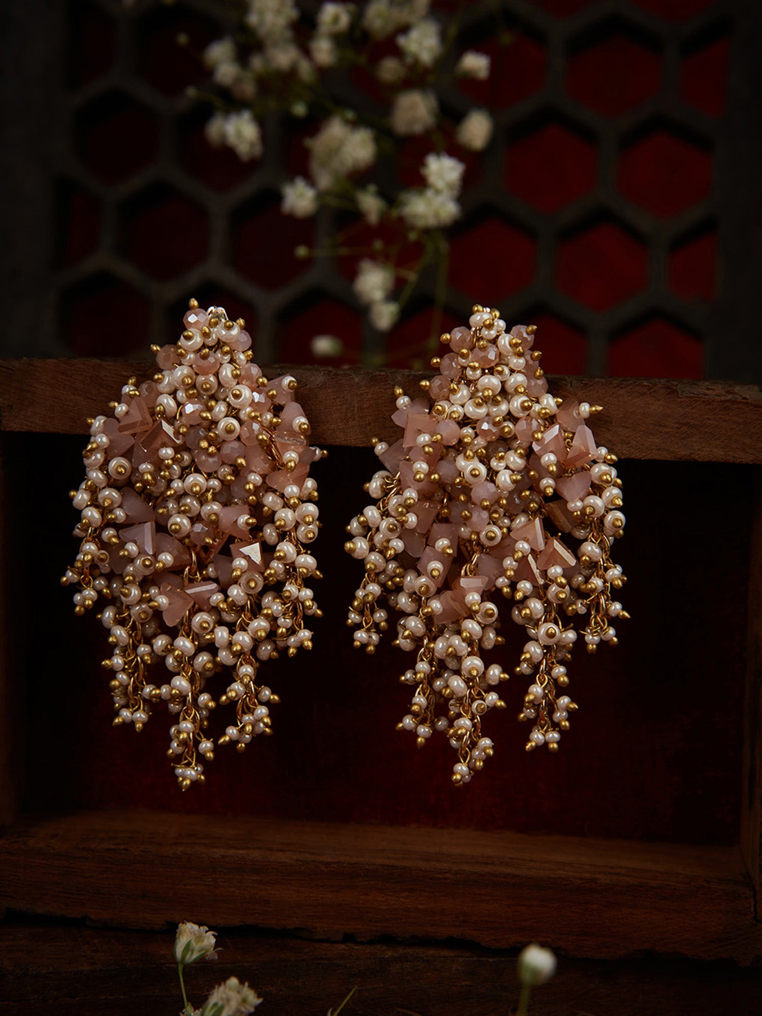 Pink And Gold Earrings On Golden Base