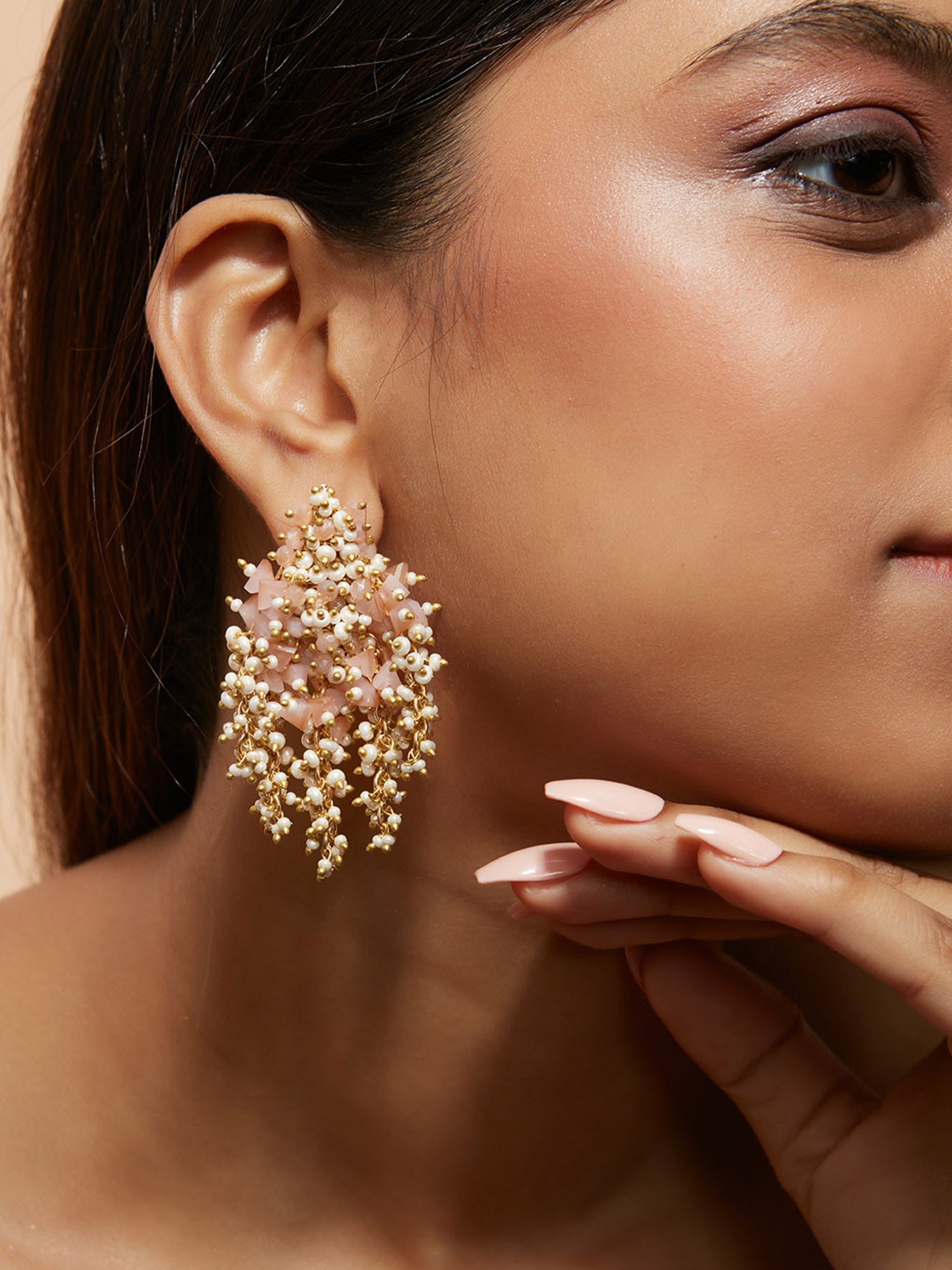 Pink And Gold Earrings On Golden Base