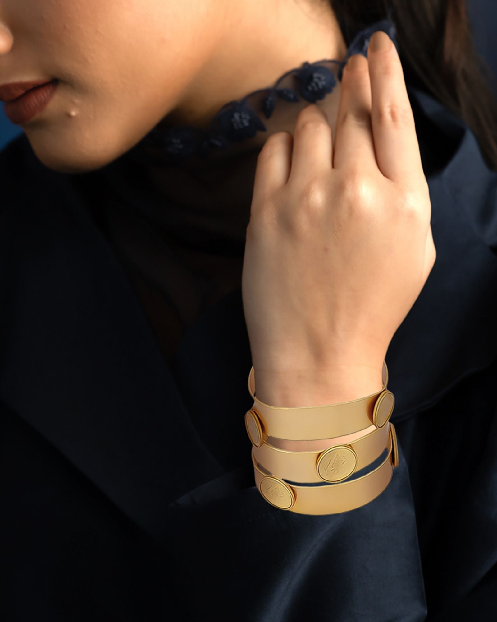 Gold triad coin hand cuff