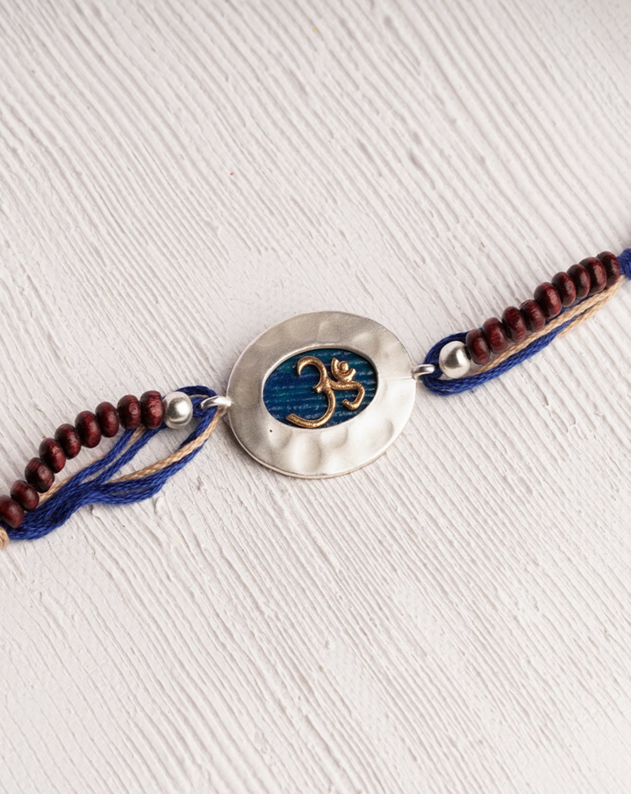 Two Toned Plated Color Om Rakhi Charm