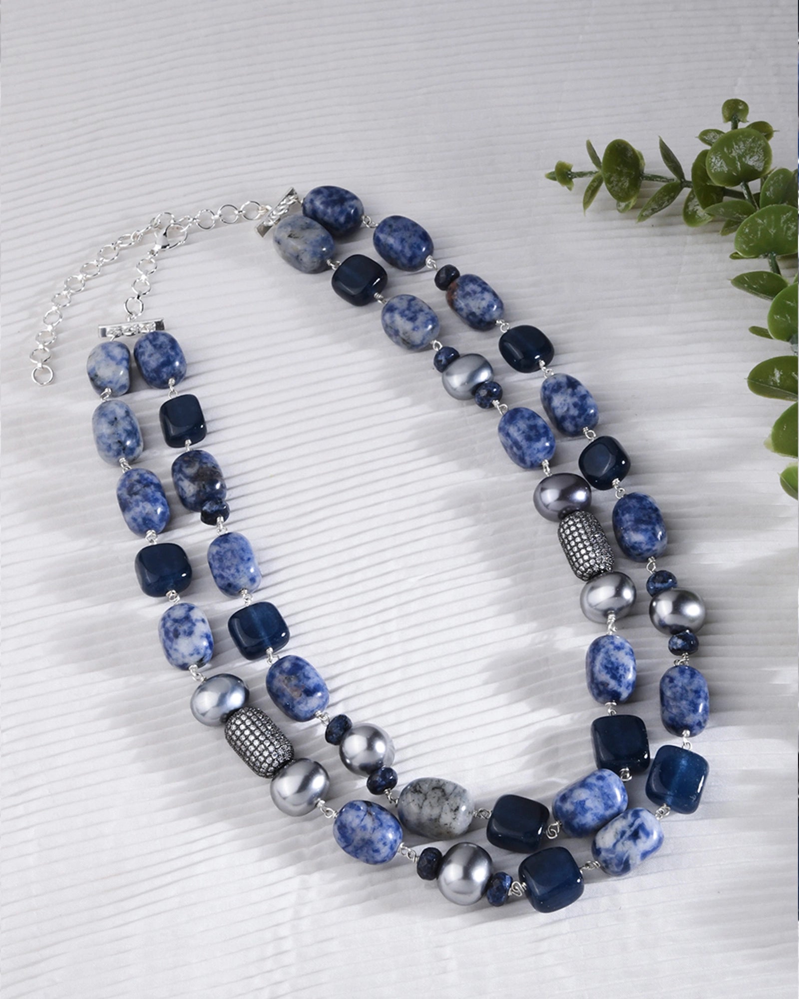 wo-layer necklace featuring silver beads and captivating blue jade stones