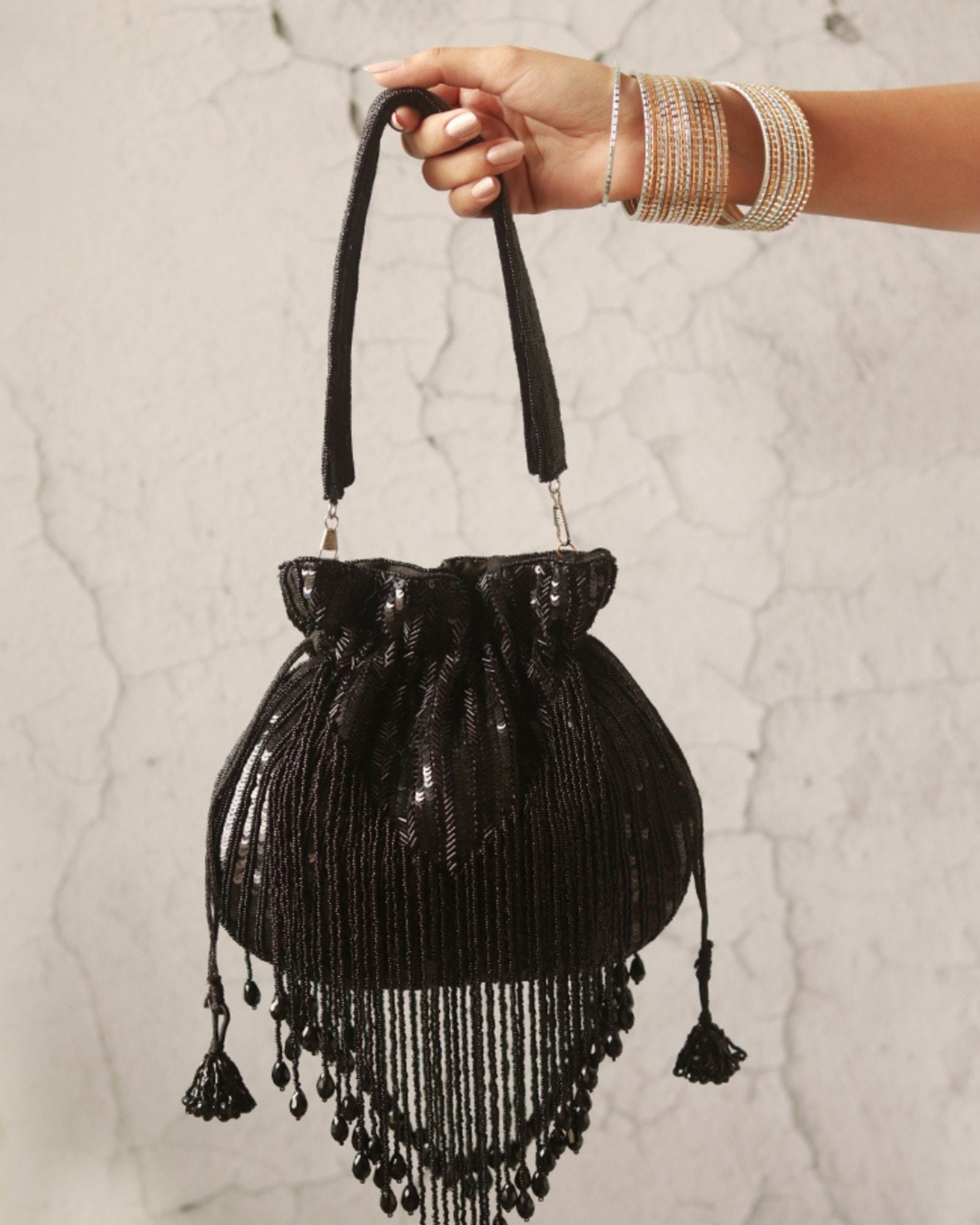 Twinkle Heavy Tassles Potli with Handle